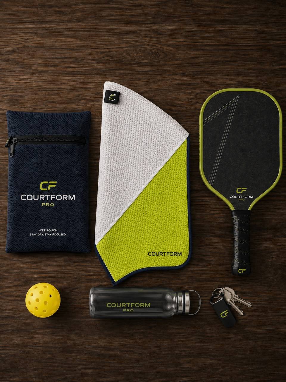Flat-lay of Courtform Pro towel, wet pouch, paddle, ball and water bottle